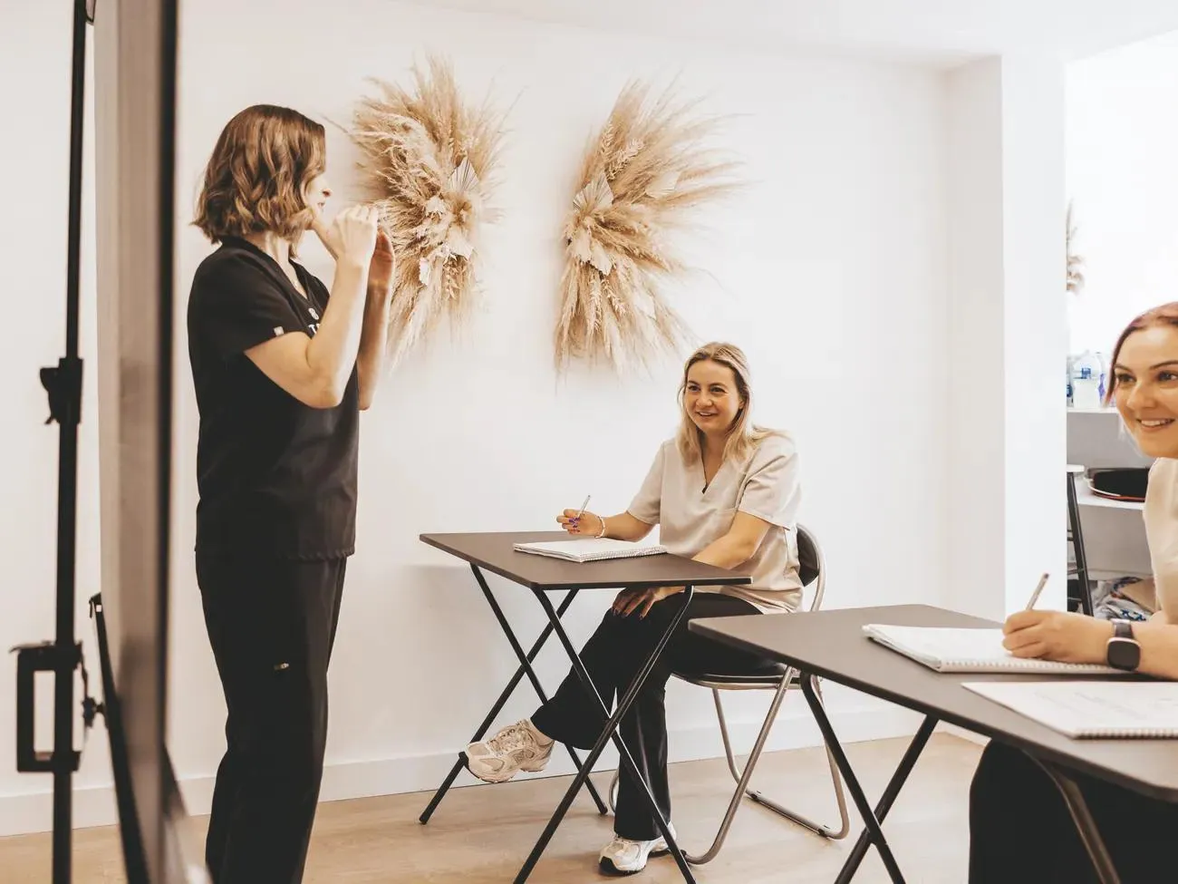 Sarah teaching a small group of students at the academy